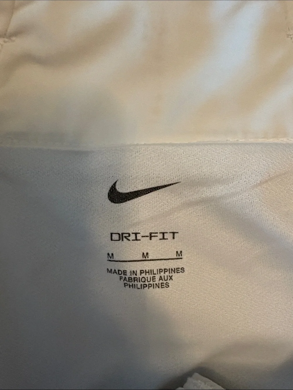 Nike Women's White Athletic Shorts with Silver Swoosh